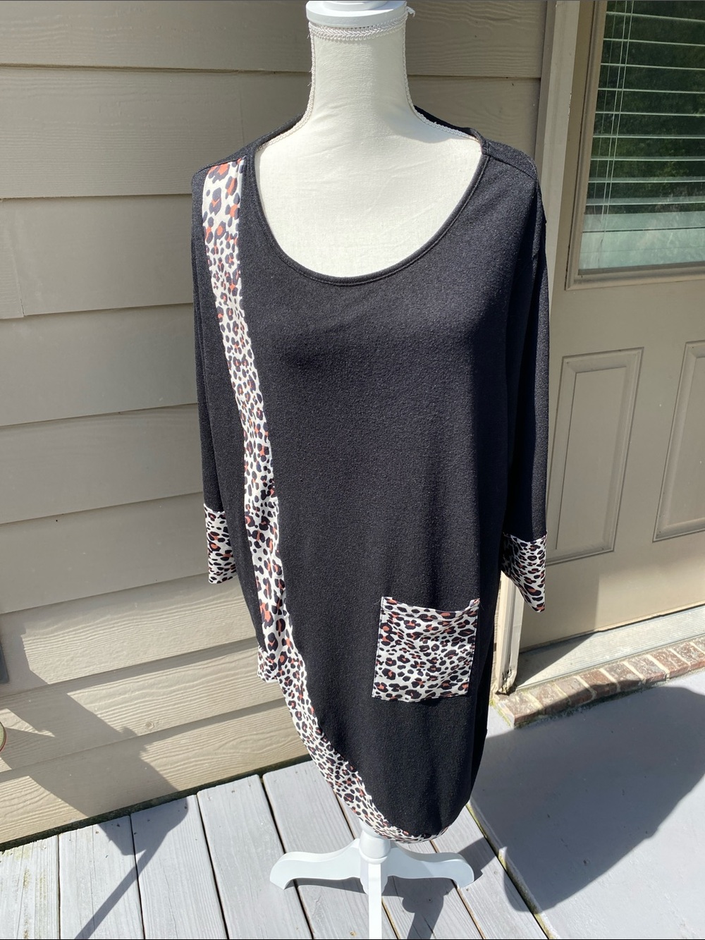 4/$20 black knit asymmetrical top with leopard print trim
